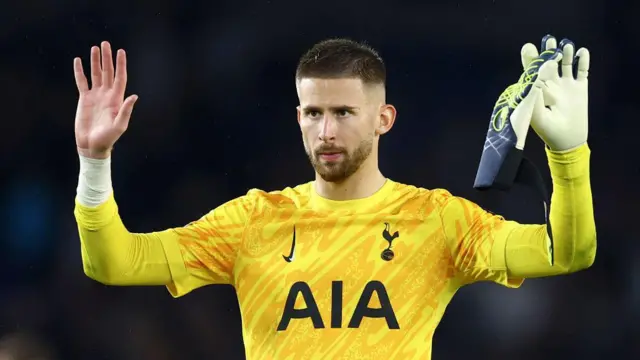 Guglielmo Vicario holds his hands up after the loss at Brighton