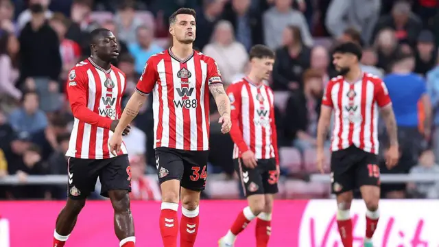  Granit Xhaka of Sunderland and teammates appear dejected 