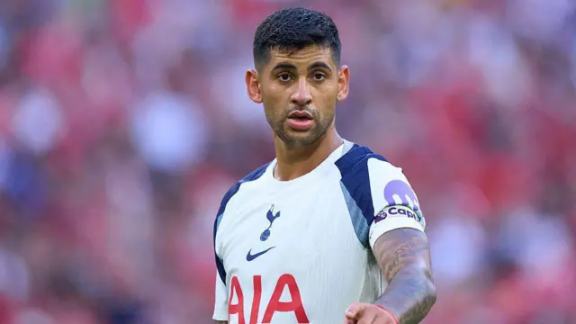 Cristian Romero in action for Tottenham and wearing captains armband during pre-season friendly