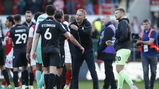 Wrexham boss Phil Parkinson celebrates with his players