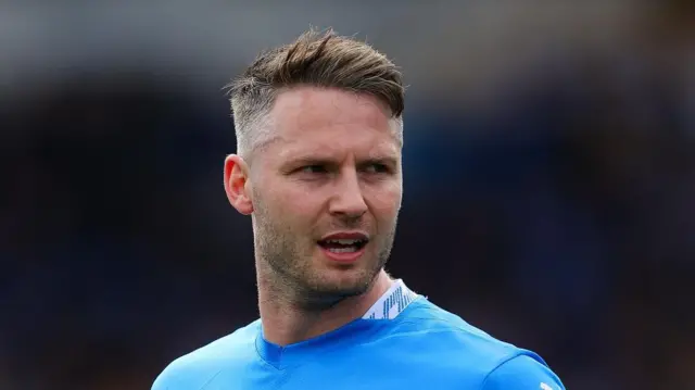 A close up of Stockport County midfielder Nick Powell during a match