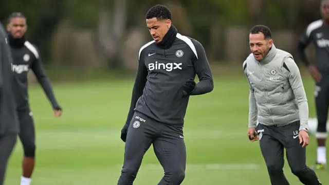 Levi Colwill training, with Liam Rosenior in the background