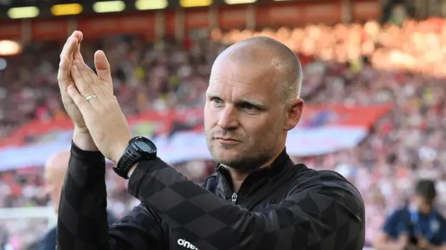 Liam Manning applauding at the end of a Bristol City match