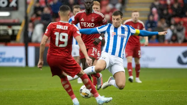 Aberdeen's Ester Sokler is tackled by Kilmarnock's Brad Lyons