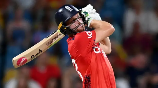 England's Jos Buttler hits a six