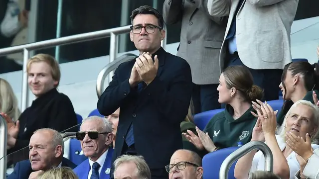 Britain's Prime Minister Andy Burnham applauds during the English Premier League football match between Everton and Crystal Palace at Hill Dickinson Stadium in Liverpool, north west England.