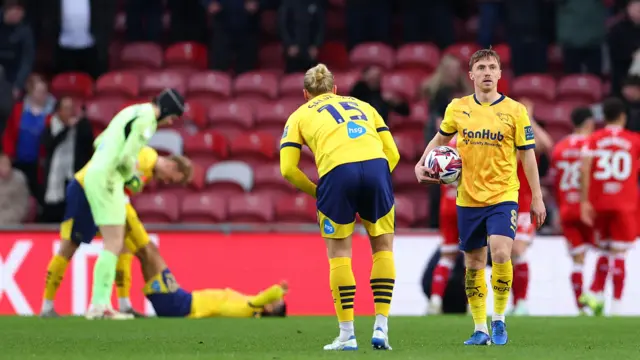 Derby's Ben Osborn holds the ball as his side reel from conceding a goal