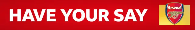 A red banner with HAVE YOUR SAY written in white block capitals. On the right side, is an Arsenal crest on a yellow background
