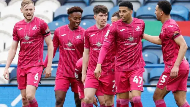 Swansea players celebrate at Huddersfield 