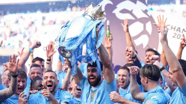 Josko Gvardiol of Manchester City lifts the Premier League trophy