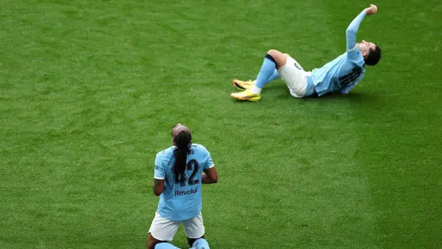 Man City players celebrate winning the FA Cup