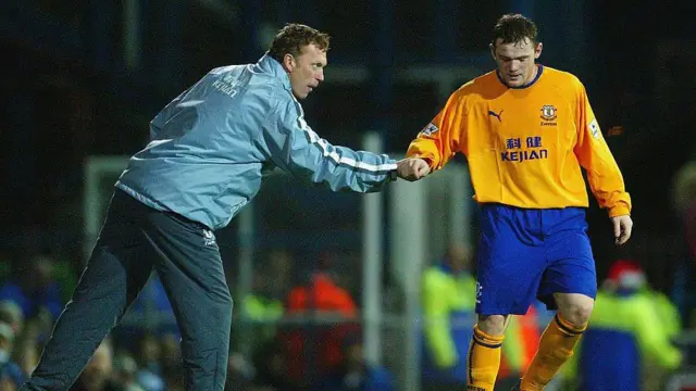 Manager David Moyes of Everton shakes Wayne Rooney's hand in 2003