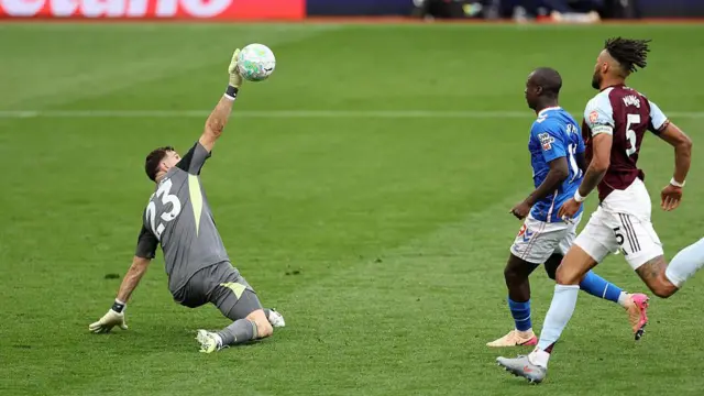 Emiliano Martinez saves a shot on goal from Habib Diarra