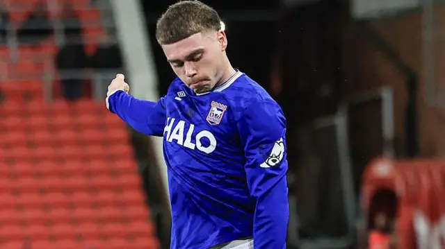 Leif Davis wearing a blue Ipswich Town shirt in action during a match