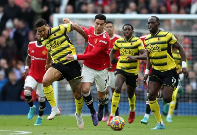 Watford players try to tackle Cristiano Ronaldo