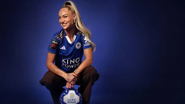 Alisha Lehmann in Leicester shirt with a ball
