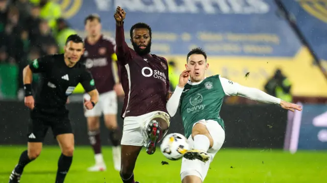 Beni Baningime and Jamie McGrath battle for possession