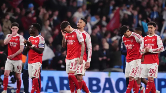 Arsenal players dejected after Carabao Cup final defeat