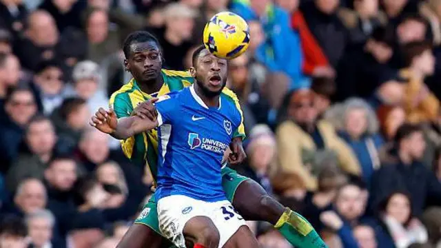 Portsmouth's Ebou Adams and WBA's Ousmane Diakite challenge for the ball