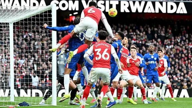 Arsenal and Chelsea contest a corner as Gabriel leaps to head