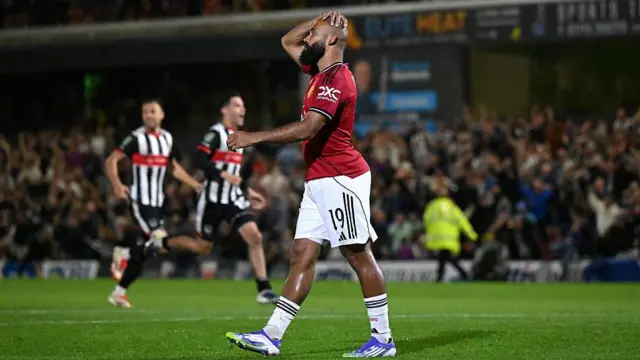 Bryan Mbeumo of Manchester United looks dejected after missing his teams thirteenth penalty