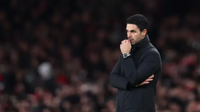 Mikel Arteta looks on from touchline thoughtfully 