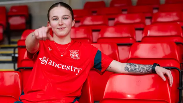Mikayla Cook in a Wrexham shirt