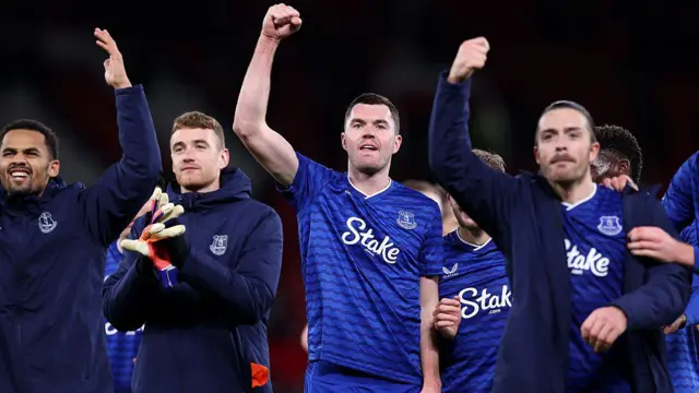 Michael Keane of Everton celebrates with the fans alongside his team-mates
