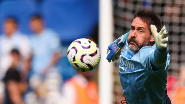 Manchester City goalkeeper Scott Carson warms up