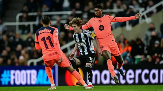 Anthony Gordon and Marcus Rashford in action