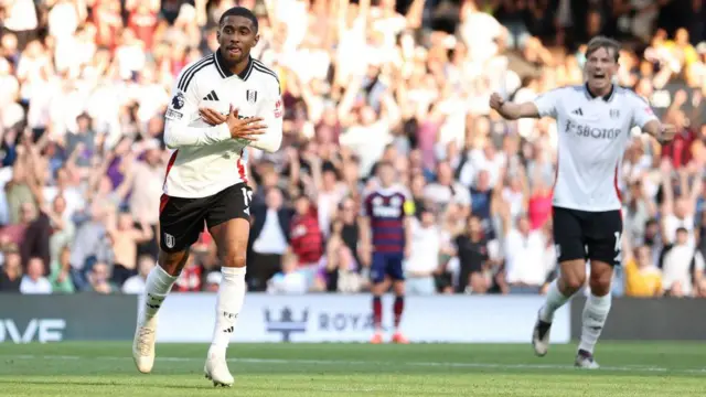 Reiss Nelson of Fulham celebrates scoring his team's third goal during the Premier League match between Fulham FC and Newcastle United FC at Craven Cottage