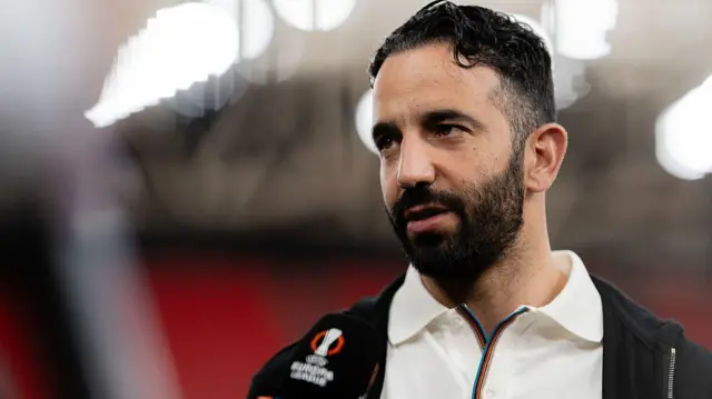 Ruben Amorim looks on while speaking to the media 