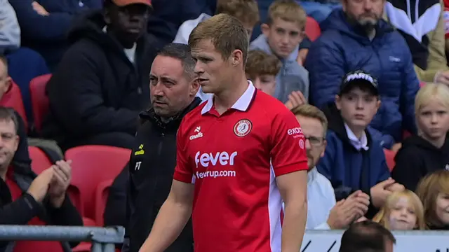 Rob Atkinson walking down the touchline after being substituted for Bristol City