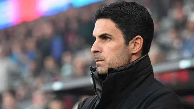 Mikel Arteta looks on