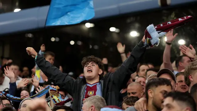 Aston Villa supporters celebrate.