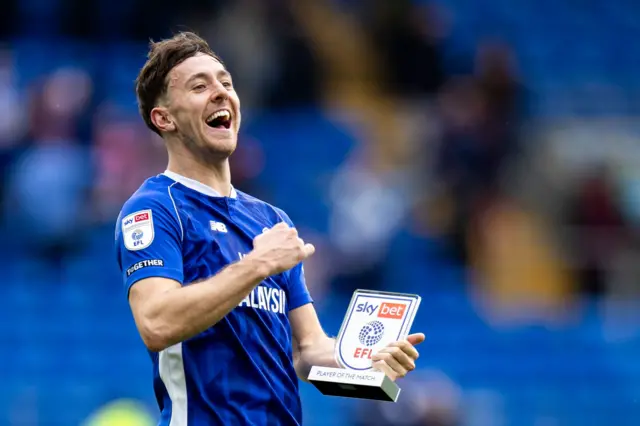 Cardiff midfielder Ryan Wintle with a man of the match award