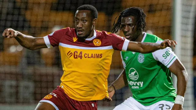 Motherwell striker Zach Robinson (left)