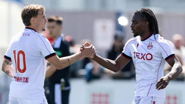 Alexander Briedl and Toyosi Olusanya celebrate after the latter's goal for Aberdeen in the 1-0 friendly win over Cove Rangers