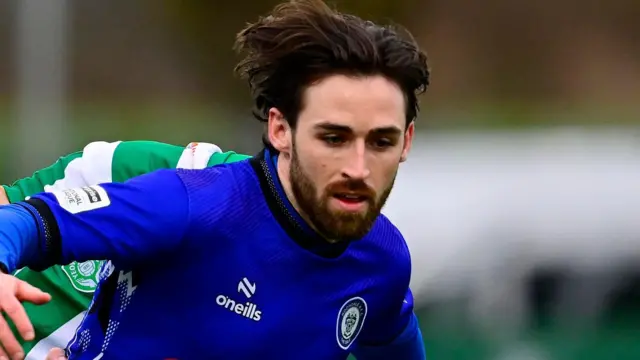 Aidan Barlow, wearing Rochdale's blue home shirt with a black collar, pictured during a game against Yeovil Town in February 2026