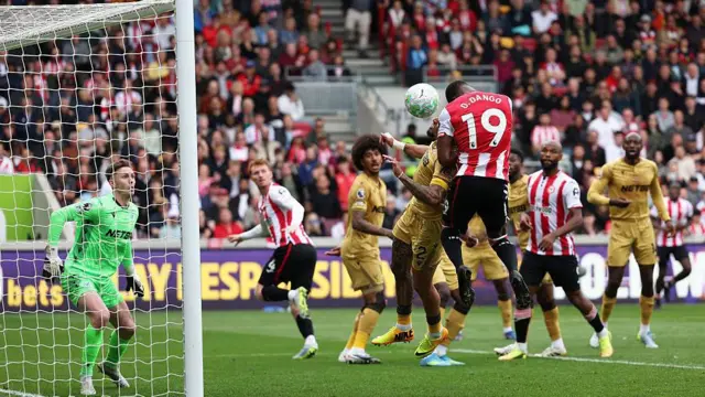 Dango Ouattara scores a late header for Brentford against Crystal Palace.
