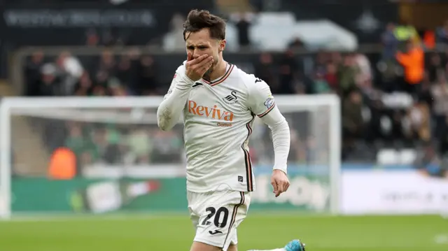 Swansea City striker Liam Cullen celebrates