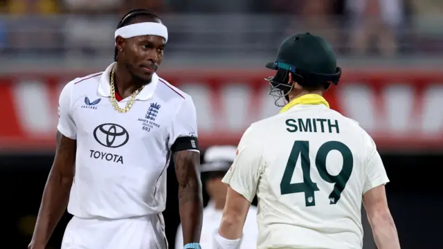 England fast bowler Jofra Archer (left) stares down Australia batter Steve Smith (right)