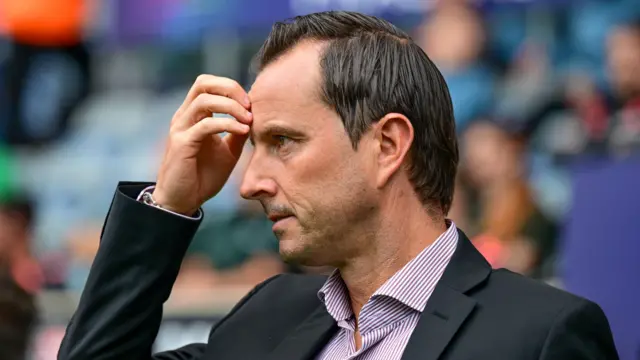 Julien Stephan scratches his head during QPR's 7-1 defeat at Coventry City