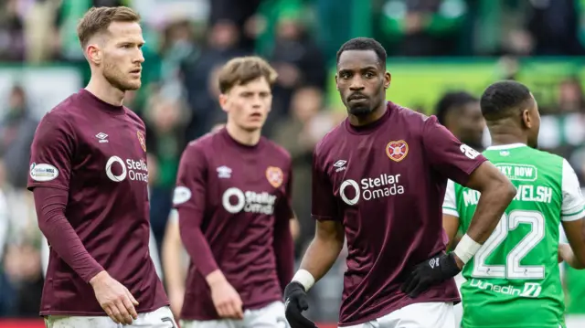 Hearts' Jamie McCart (L) and Elton Kabangu (R) look dejected at full time