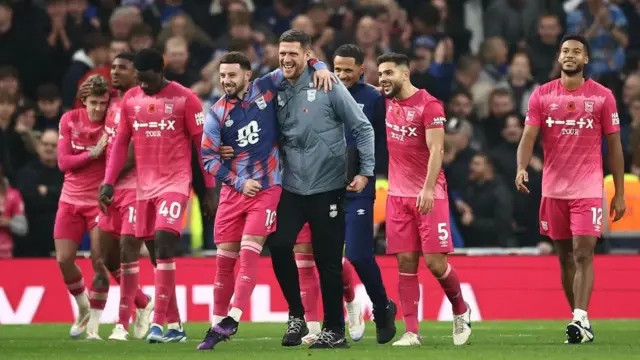 Ipwich players and staff celebrate after victory against Tottenham