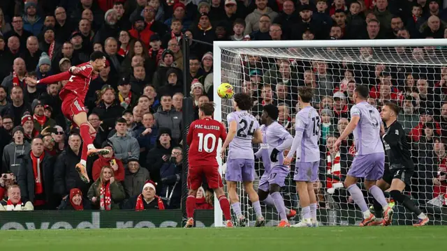 Hugo Ekitike of Liverpool heads the ball to score his team's second goal