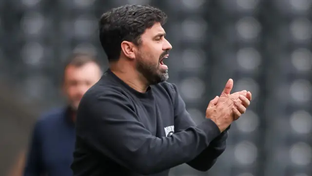 Vitor Matos applauds on the touchline