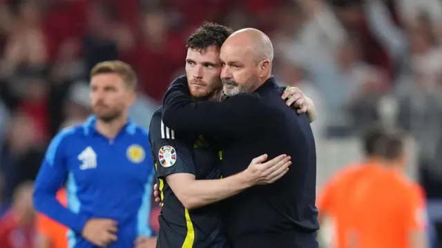 Andy Robertson and Steve Clarke hug after defeat to Hungary