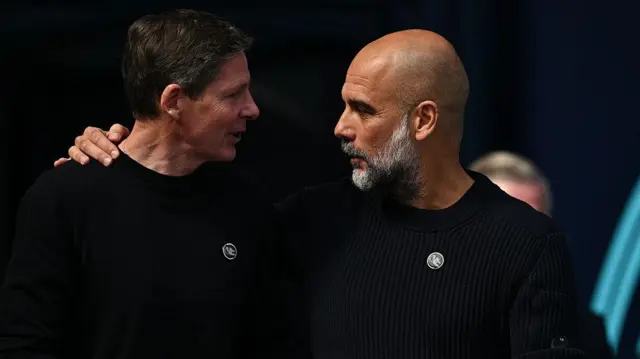 Oliver Glasner and Pep Guardiola chat before match