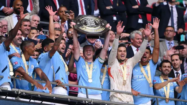 Manchester City players celebrate Community Shield win